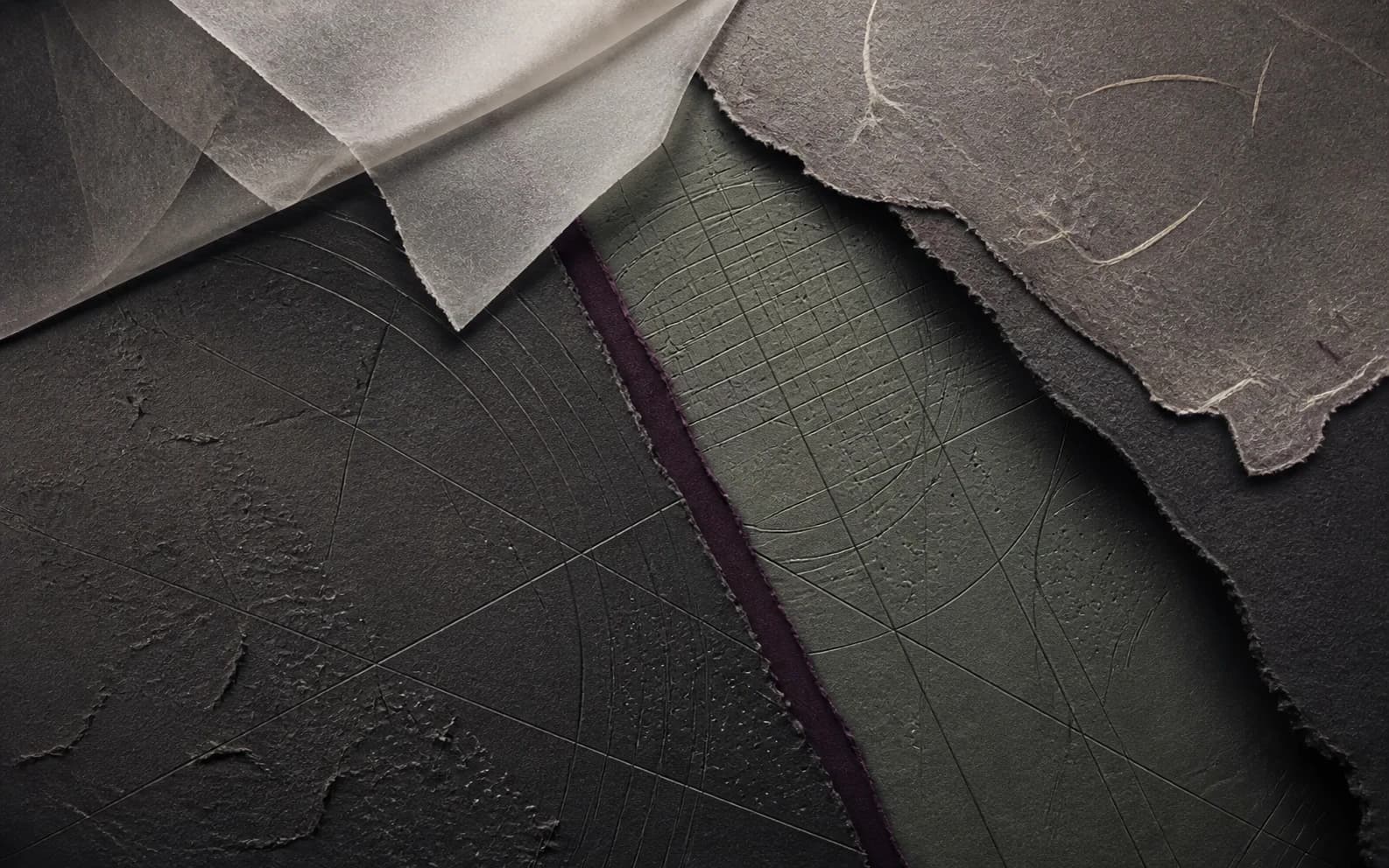 Layered charcoal, sage and plum handmade papers divided by fine cartographic lines